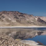 A mountain reflecting off Laguna Maule